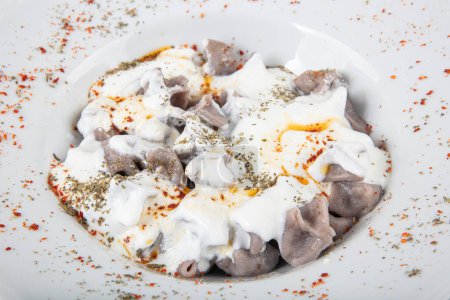 Manti from buckwheat flour. Manti Turkish Ravioli Kayseri with yogurt and chili sauce.