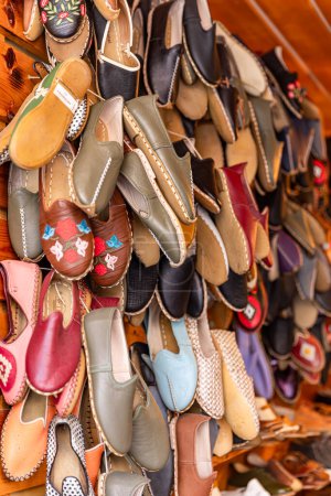 Sandal. 'Yemeni', a Traditional Hand Made Leather Shoes. Traditional turkish leather shoes named yemeni. Colorful handmade leather slipper shoes displayed on the street market in Turkey.
