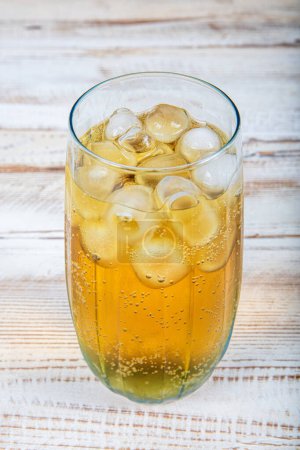 A glass of energetic drink consisting of energy drink and ice. Iced soda. Iced cold energetic drink. Sparkling drink. Iced soda.