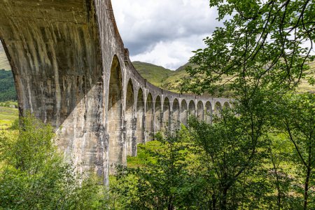 June 2, 2022. Glenfinnan Scotland, United Kingdom. Mountain landscape . View of the railway viaduct.