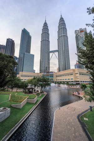 Photo for Petronas Twin Towers or KLCC Twin Towers, 88-storey supertall skyscrapers in Kuala Lumpur, a major landmark of the city, view from urban sanctuary KLCC Park. - Royalty Free Image