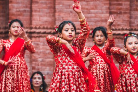 Photo for Kathmandu, nepal. 26th august, 2023: little girls performing a traditional nepalese dance on street - Royalty Free Image