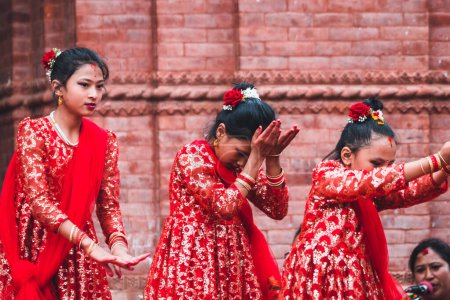 Photo for Kathmandu, nepal. 26th august, 2023: little girls performing a traditional nepalese dance on street - Royalty Free Image