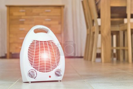 Photo for Electric fan heater in the cozy home interior. - Royalty Free Image