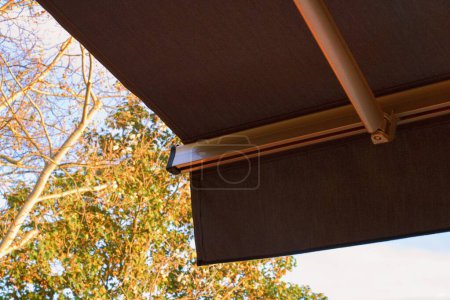 Sunprotecting awning from fabric material