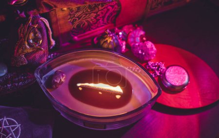 Photo for Candle burns on the altar, candles magic, clean aura and removing negative energy, wicca concept - Royalty Free Image