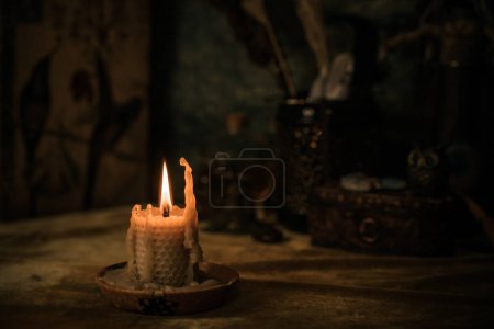 Foto de Illustration of concept remove negative energy away from you, home, another. Magic and rite, candle is burning - Imagen libre de derechos