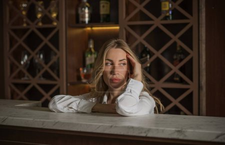 Photo for Portrait of pretty woman in a bar or club, concept of drinks, beverage - Royalty Free Image