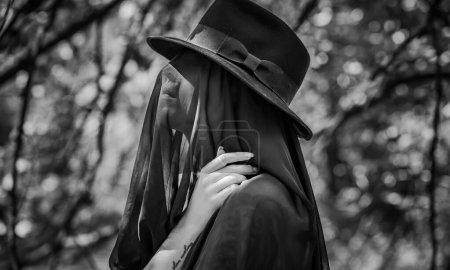 Photo for Woman in black, grief dark mood, melancholy and depression concept, lady cover black cloth - Royalty Free Image