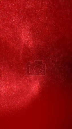 Téléchargez les photos : Un essaim abstrait de particules rouges d'étoiles de flottabilité liquide. Élégantes lumières cosmiques festives fond d'illustration 3D. Vertical magie vacances toile de fond et scintillement poussière de fée ralenti fond d'écran. - en image libre de droit