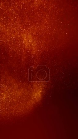 Foto de Oro rojo magia abstracta brillante estrella partículas luces fondo de pantalla. Lujo vertical y glamour alto detalle Fondo de ilustración 3D. Brillante suave foco festivo chispas de ámbar superposición. - Imagen libre de derechos
