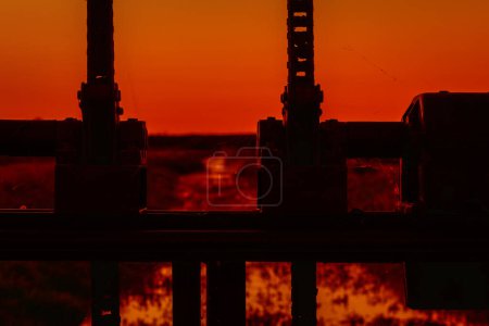 Photo for WEIR - Picturesque dawn and hydrotechnical equipment on the river - Royalty Free Image