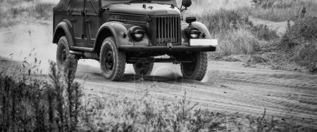 Photo for OLD MILITARY CAR - Russian all-terrain vehicle on a dirt road - Royalty Free Image