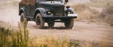 Photo for OLD MILITARY CAR - Russian all-terrain vehicle on a dirt road - Royalty Free Image