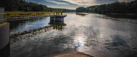 Photo for HYDROTECHNICAL CONSTRUCTION - Valves and other structural elements on the lake - Royalty Free Image