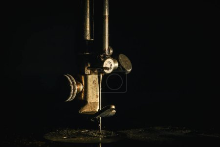 NEEDLE - Fragment of an old manual sewing machine
