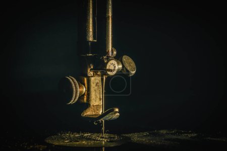 NEEDLE - Fragment of an old manual sewing machine