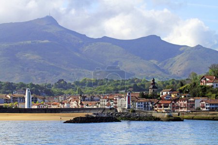 Photo for Saint-Jean-de-Luz seen from the sea with Pyrenees mountains at the horizon, Pyrenees atlantiques, France - Royalty Free Image