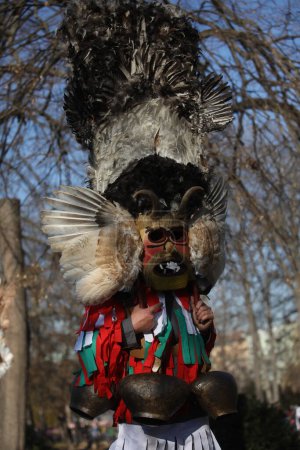 Téléchargez les photos : Sofia, Bulgaria - January 8, 2023: Masquerade festival "Surva" in Sofia, Bulgaria. People with mask called Kukeri dance and perform to scare the evil spirits. - en image libre de droit