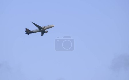 Photo for Passenger airliner of the model Airbus A320 of Vistara airlines ascending after takeoff. Location: Mumbai, India. Date: May 15 2022 - Royalty Free Image