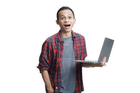 Foto de Guapo asiático hombre celebración ordenador portátil en aislado fondo - Imagen libre de derechos