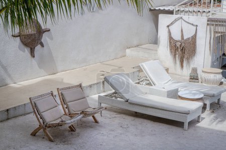 Photo for Outdoor space with lounging furniture, with beach chair and sunbed - Royalty Free Image