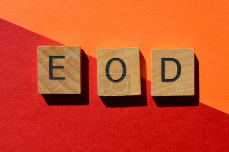 Photo for E O D, abbreviation for End Of Day, in wooden alphabet letters isolated on background - Royalty Free Image