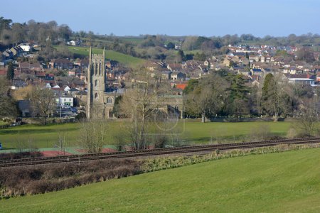 Photo for Bruton, Somerset, England - view to town and church from the dovecote, with railway tracks in foreground - Royalty Free Image