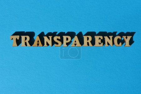 Photo for Transparency, word in wooden alphabet letters isolated on blue background - Royalty Free Image