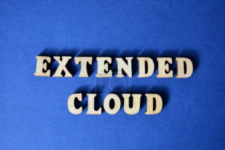 Photo for Extended Cloud, word in wooden alphabet letters isolated on blue background - Royalty Free Image