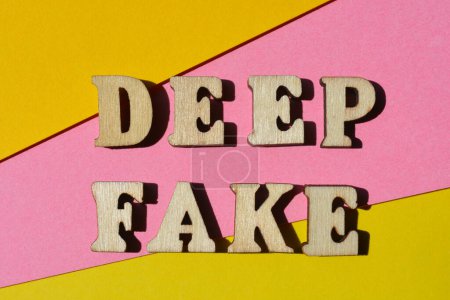 Photo for Deep Fake, words in wooden alphabet letters isolated on pink and yellow background - Royalty Free Image