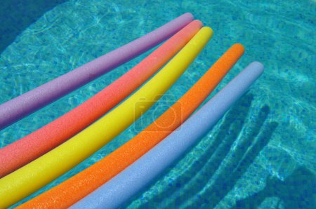 Photo for Colorful swim noodles floating swimming pool - Royalty Free Image