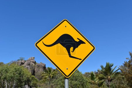 Photo for Iconic yellow kangaroo warning sign against blue sky with copy space - Royalty Free Image