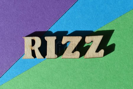 Photo for Rizz, Gen Z slang for Charisma, word in wooden alphabet letters isolated on colourful background - Royalty Free Image
