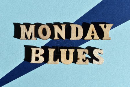 Monday Blues, words in wooden alphabet letters isolated on background as banner headline