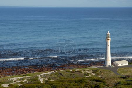 Slangkop Lighthouse and Western Cape coast with  view over sea to horizon, Kommetjie,  Cape Town, South Africa