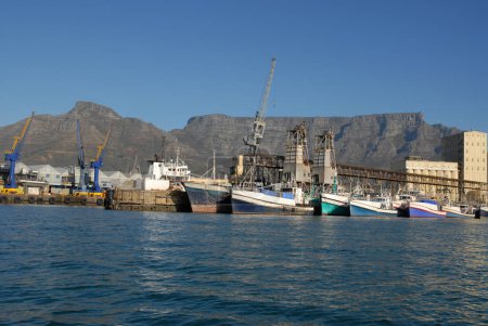 Port of Cape Town, with commercial docks, ships and warehouses and Table Mountain in background, Western Cape, South Africa 