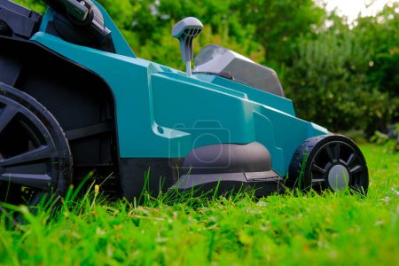 Garden equipment and tools.cutting grass close-up.Lawnmower on a mowed lawn close-up. 