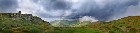 Photo for Thunderstorm dark clouds over mountain landscape panorama. Mount Gutyn Tomnatyk and glacial lake Brebenekul from the slopes of Mount Brebeneskul, Carpathian mountains in Ukraine - Royalty Free Image