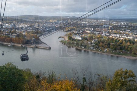 Photo for The German Corner in Koblenz, Germany where river Rhein and Mosel meet. This place is a symbol of the unification of Germany. View from the cable car to the Ehrenbreitstein castle - Royalty Free Image