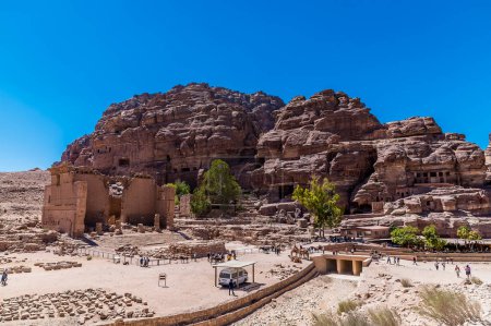 Photo for A view towards temple ruins and the western cliff face in the ancient city of Petra, Jordan in summertime - Royalty Free Image