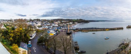 Photo for A view over Saundersfoot village and harbour at high tide in Wales in winter - Royalty Free Image