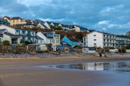 Photo for A view up the beach as the tide turns in Saundersfoot, Wales in winter - Royalty Free Image