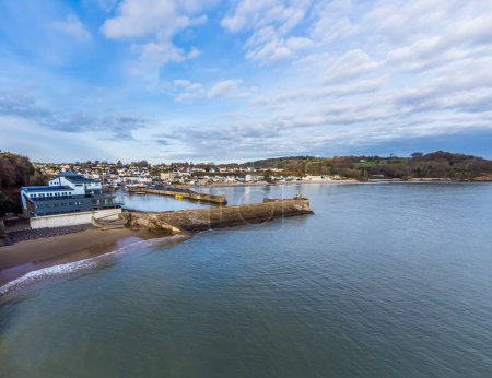 Photo for An aerial view across the coastline, harbour and village of Saundersfoot, Wales in winter - Royalty Free Image
