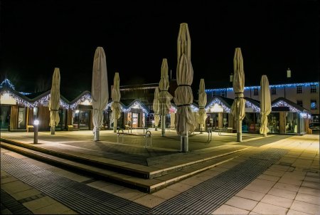 Photo for A view across the square at night in Saundersfoot village in Wales in winter - Royalty Free Image
