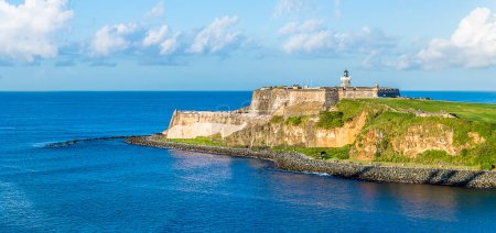 Photo for A view from the harbour entrance past fortifications in San Juan, Puerto Rico on a bright sunny day - Royalty Free Image