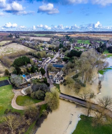 An aerial view over countryside around the village of Duddington, UK on a bright sunny day