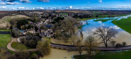 A panorama aerial view over the River Welland floodplain beside the village of Duddington, UK on a bright sunny day