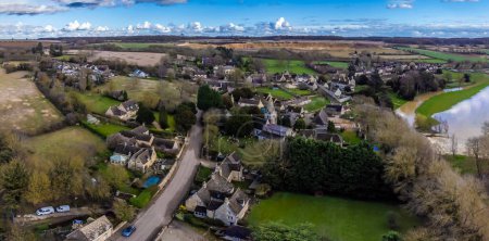 An aerial view over the village of Duddington, UK on a bright sunny day