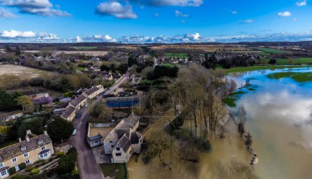 An aerial view over the River Welland floodplain and the village of Duddington, UK on a bright sunny day
